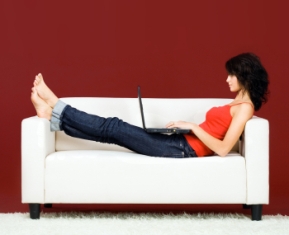 Woman seraching for homes online at troyVrealestate.com
