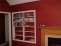 Fireplace and built-in shelving in living room no image