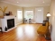 Gas fireplace, wood floors, and vinyl wiindows no image