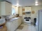 Full kitchen in cottage includes stove and refrigerator, washer and dryer no image